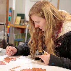 Artist with disability Summer Fleming in Art Box Art Art Studio eyes down concentrating