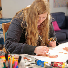 Artist with disability Summer Fleming in Art Box Art Art Studio eyes down concentrating
