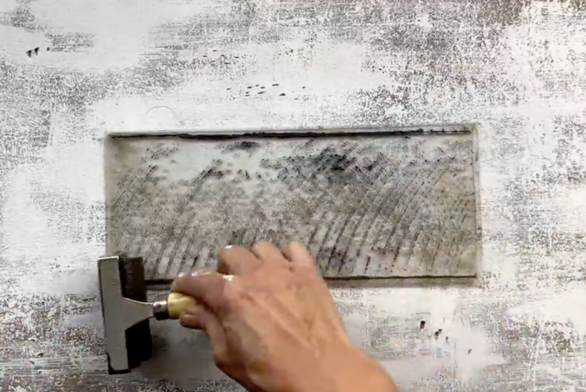 Applying black paint to Barnwood stamp