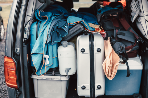 suitcases packed in a car