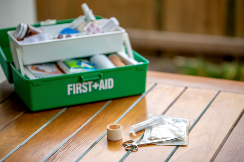 first aid kit displayed on table