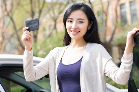 woman holding license