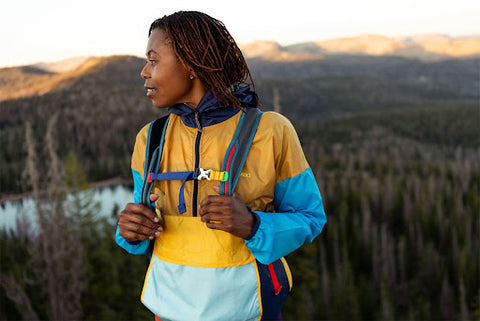 woman hiking with proper hiking clothes and backpack