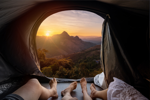 legs in a tent with beautiful view