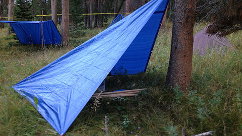 A simple blue lean-to tent to shelter from the elements