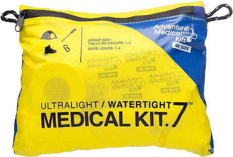 A yellow adventure medical first aid kit that is closed