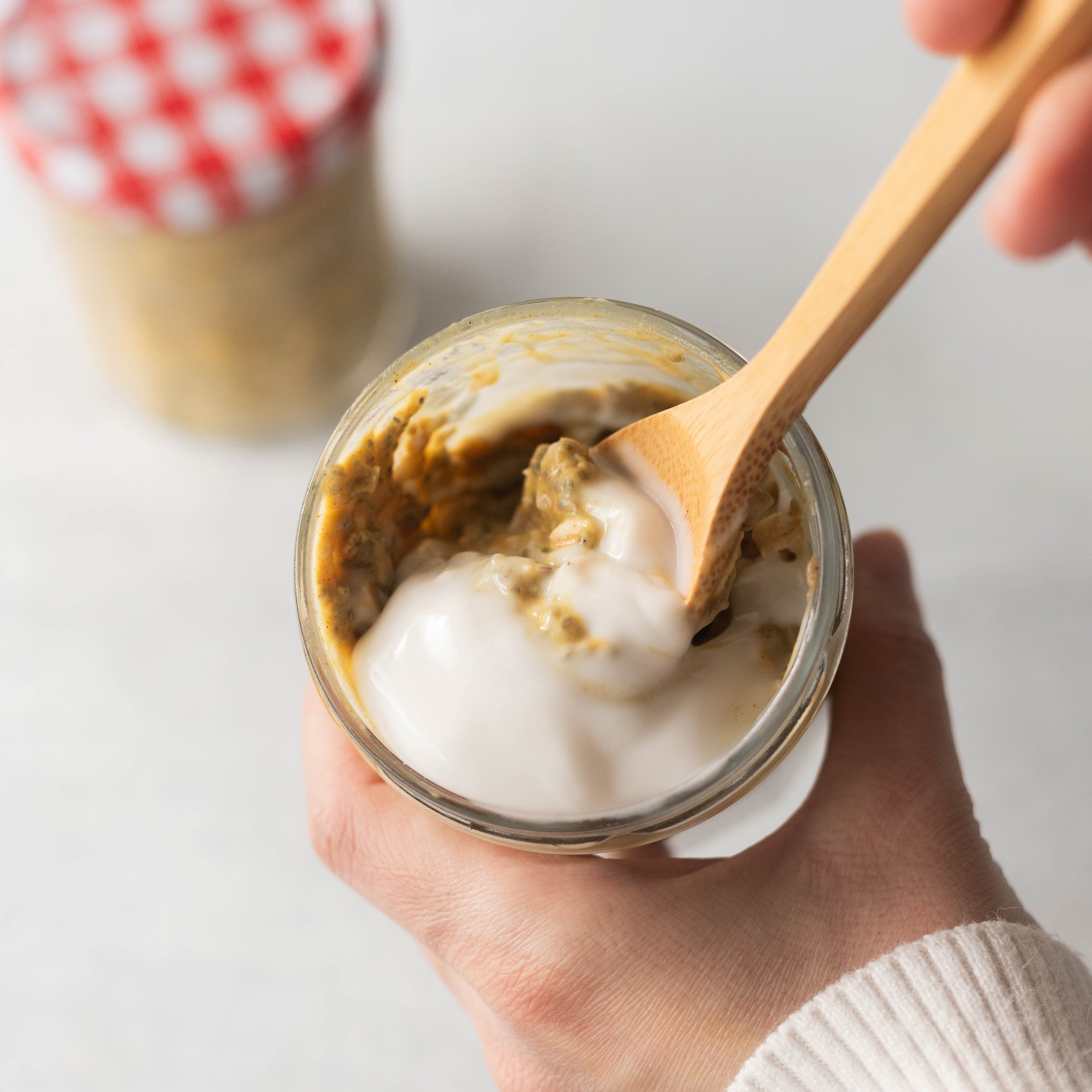 Spoon in Jar of Golden Milk Protein Oats