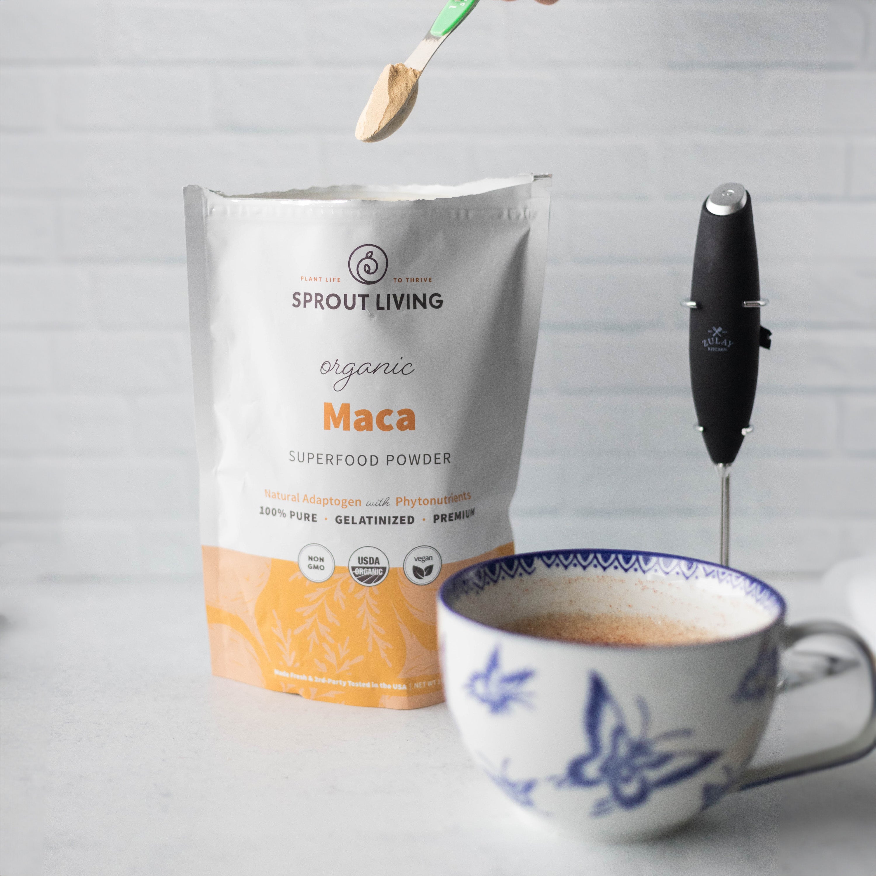 Maca Superfood Powder and Latte in Mug with Whisk