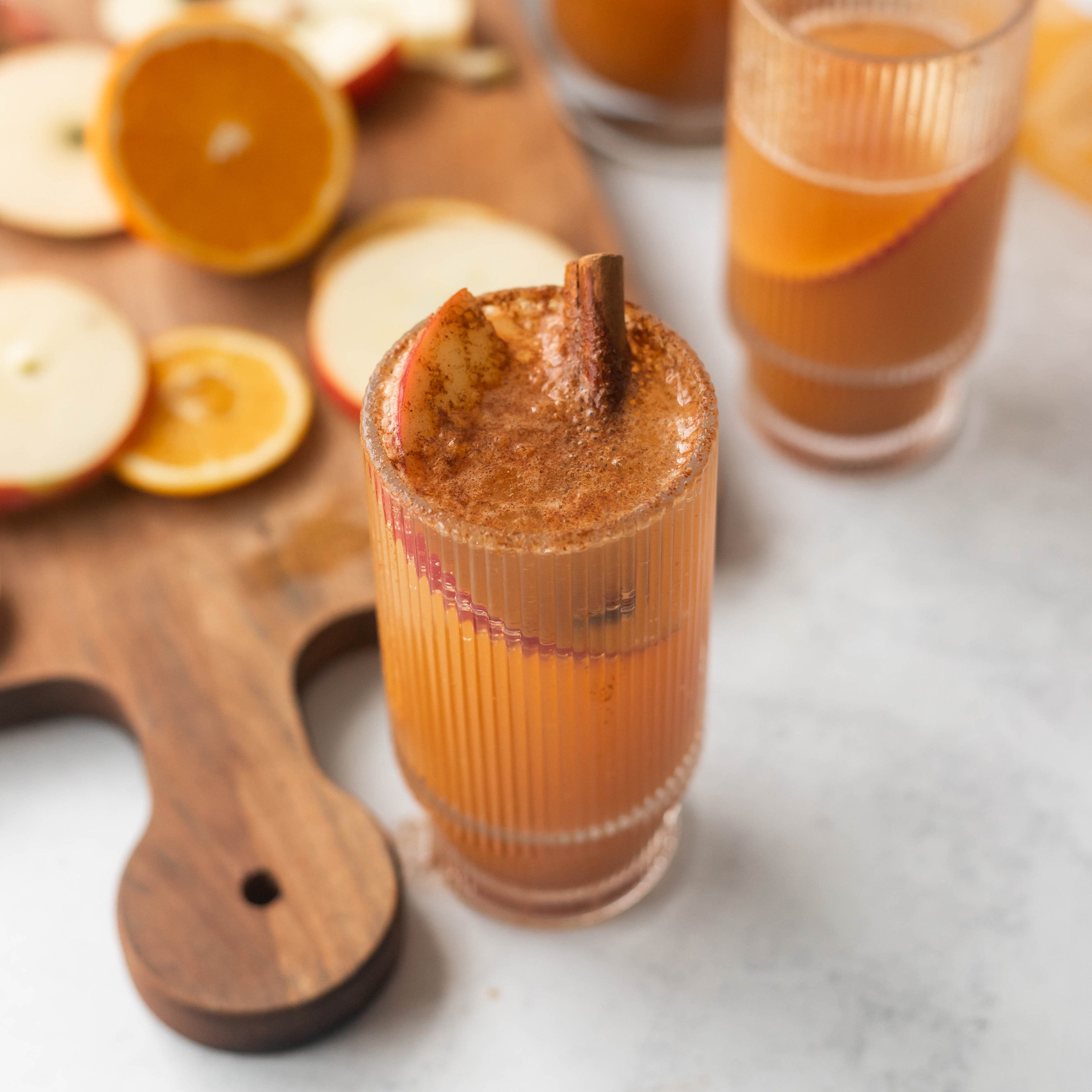 Apple Cider in Glass with Cinnamon Garnish