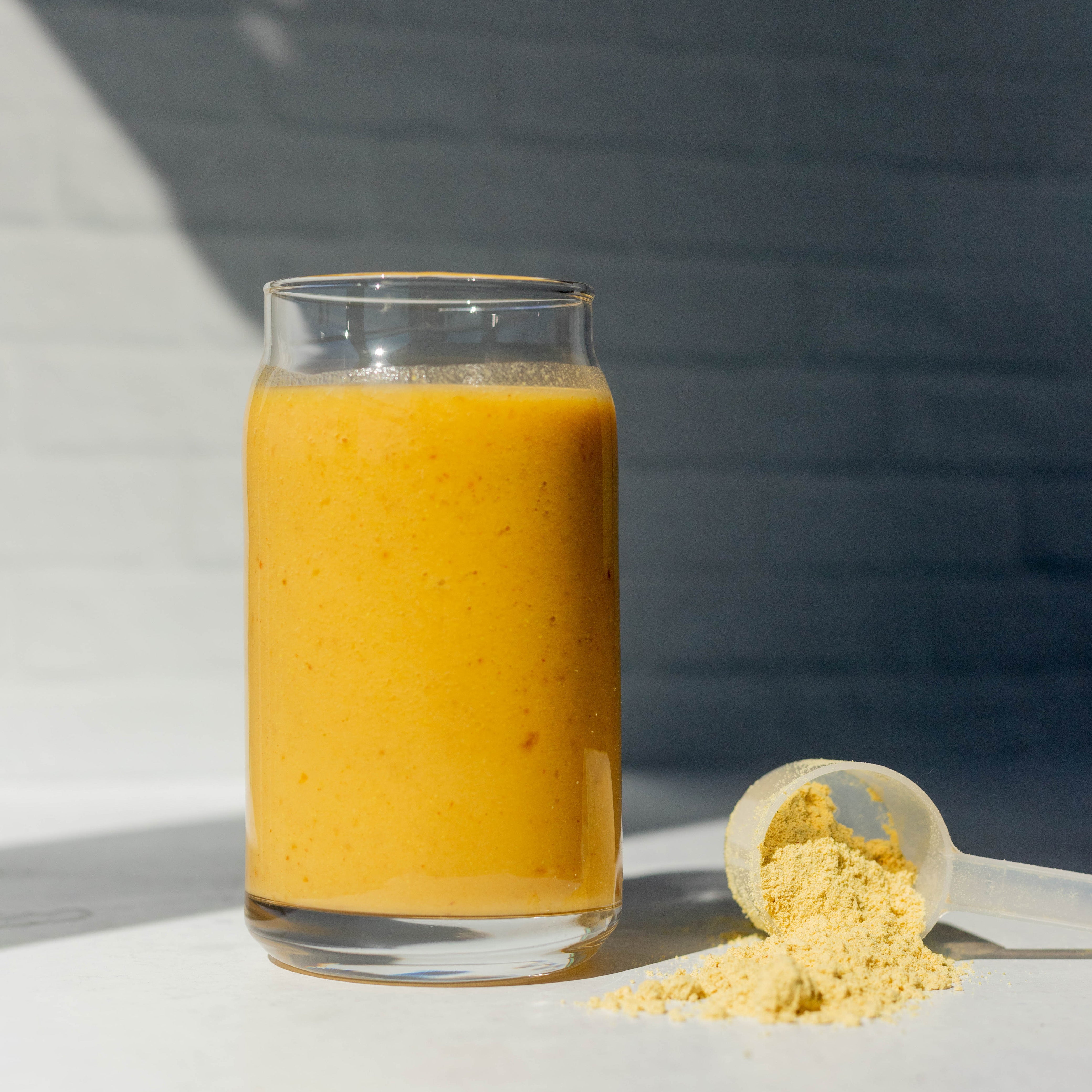 Workout Smoothie in Glass with Protein Scoop