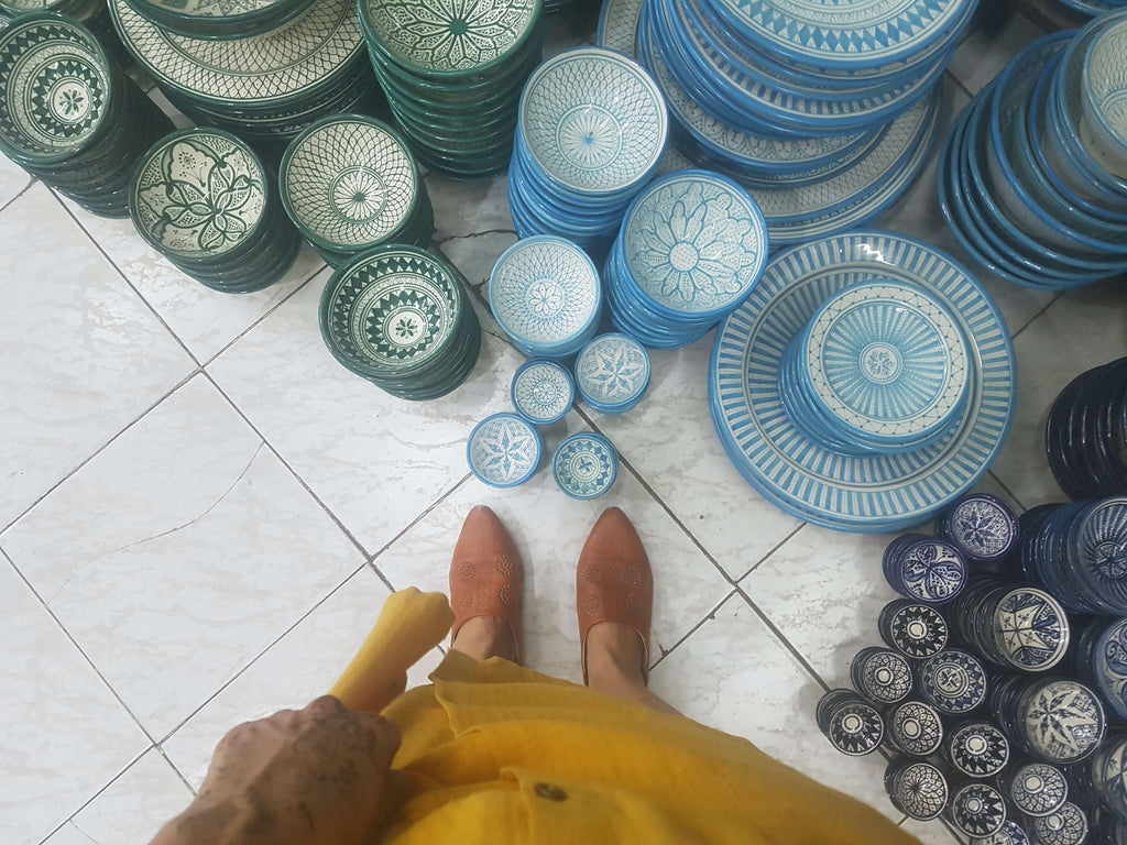 looking down on a stack of plates in the Marrakesh souk with geometric patterns.