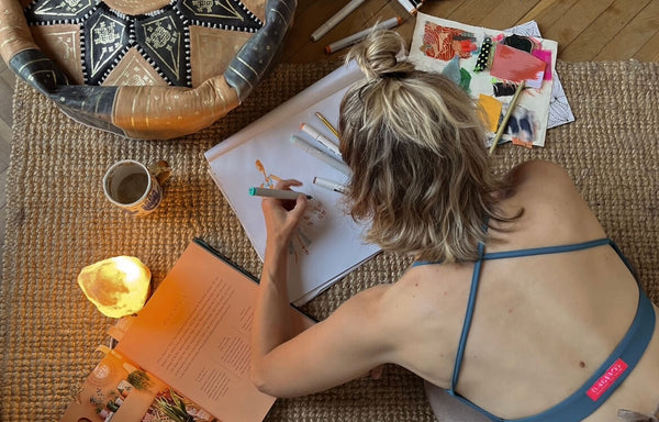 Fashion designer putting together her collection with sketches