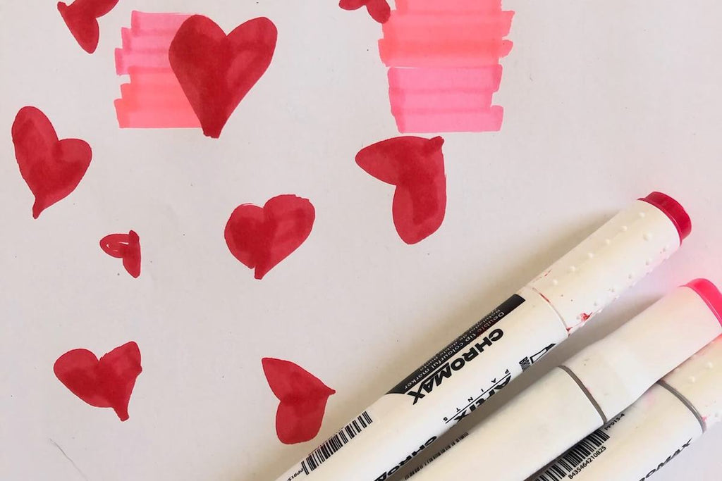 Copic marker drawings of hearts in red and pink