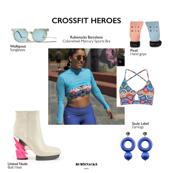 Gift Guide for women who do crossfit and functional fitness exercises - image includes small images of various gift ideas, such as a sunglasses, lightning bolt boots, blue earrings, hand grips, and a colorful sports bra. Center image is a close up of a woman wearing a colorful sports bra with circle motifs, a blue crop top and periwinkle color biker shorts.