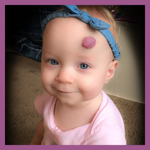 Toddler with denim bow in her hair 