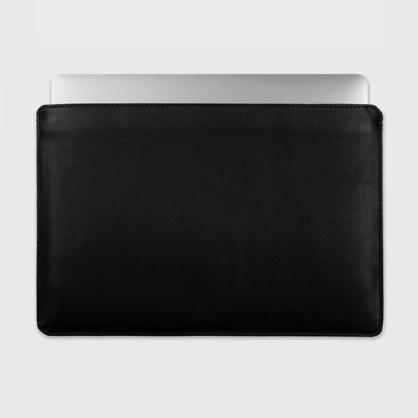 Why leather is a popular choice for MacBook sleeves?