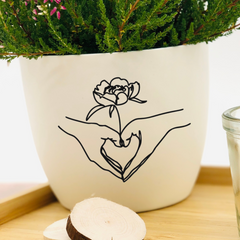 Flower pot with line art design as a gift