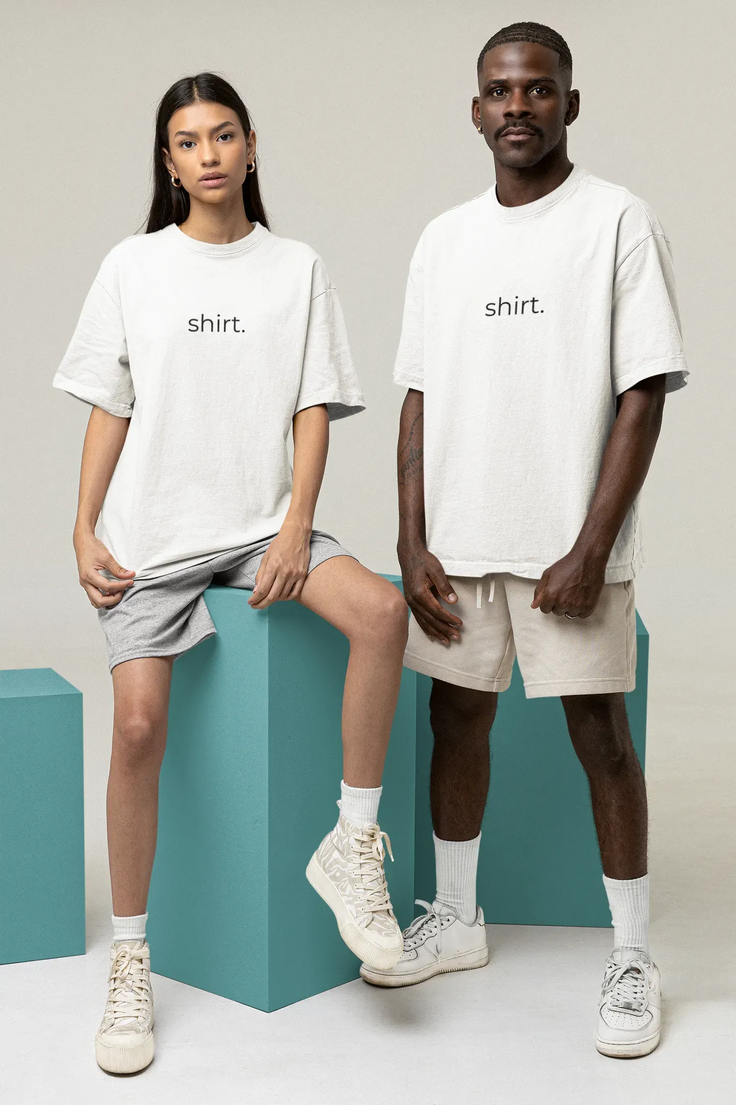 A man and a woman wearing shirts with the word 'shirt.' on them.