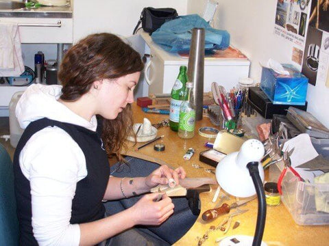 Annie working at her bench in our Toi Pōneke studio in Wellington.