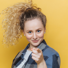 woman pointing at reader