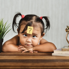 baby with question mark on head