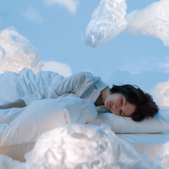 Woman sleeping in clouds