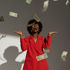 Woman tossing money in air