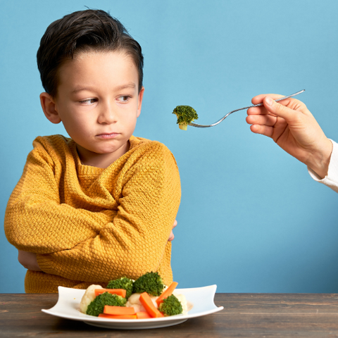 Kid refusing brocolli