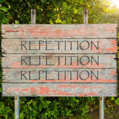 Sign that says "repetition" 3 times