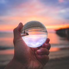 Person holding crystal ball