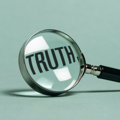 Magnifying glass under "truth"