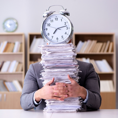 man holding clock