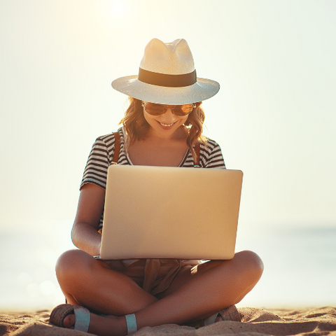 typing on beach