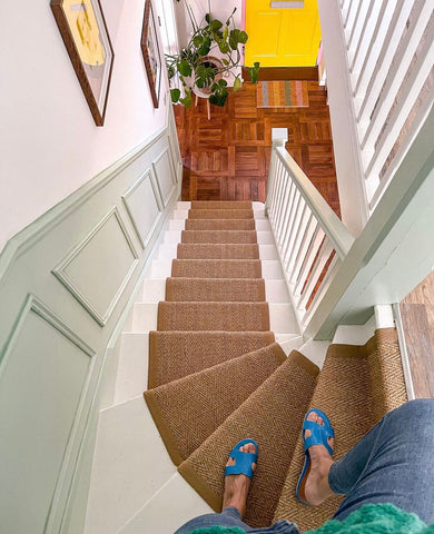 Traditional style panelling on stairs, painted pale green 