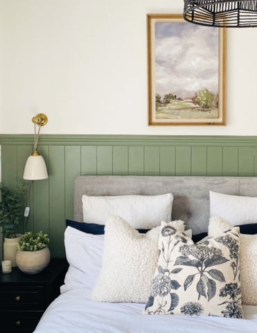 Sage green shiplap panelling in bedroom 