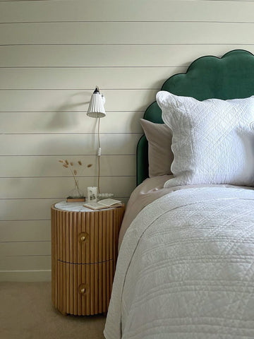 Horizontal slatted shiplap wall, with scalloped edged bedhead and bedside table