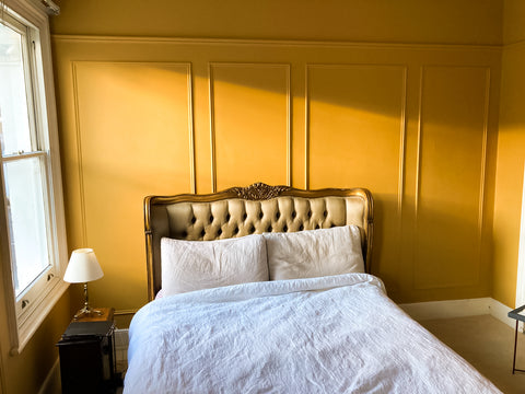 Traditional wall panelling in sunlit bedroom 