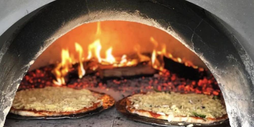 Pizza cooked in wood-fired oven - TWFC