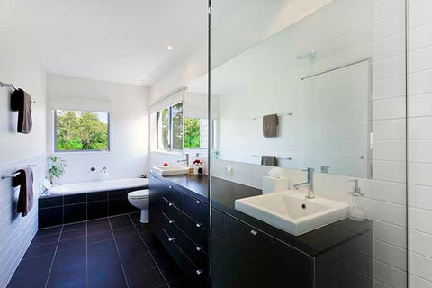 A large bathroom with a double sink vanity.
