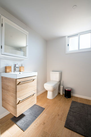 A small, modern floating bathroom vanity. 