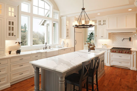A large, bright white kitchen. 