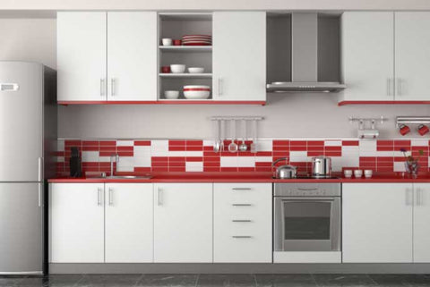 A modern kitchen with a creative red and white tile backsplash. 