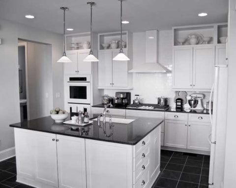 A kitchen with bright white cabinets and a kitchen island.