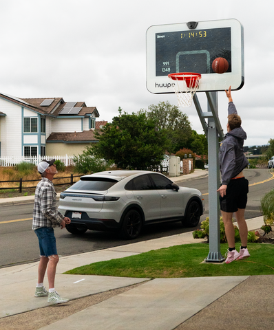 A player going up for a layup off of an assist.