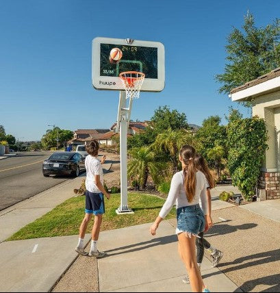 Family enjoying playing basketball on the huupe.