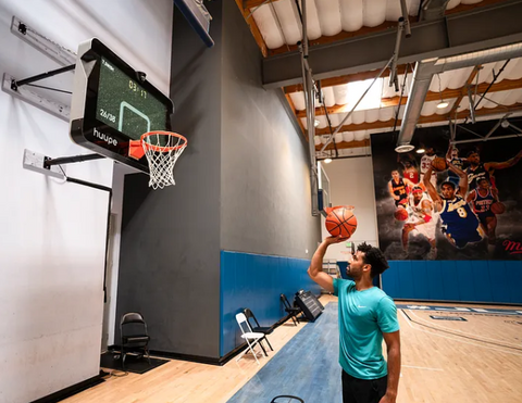 A player looking up and shooting at the huupe.