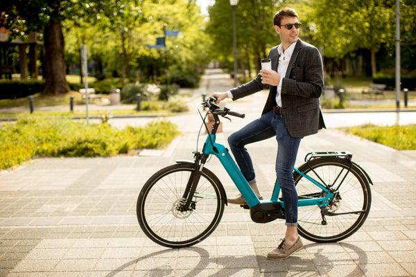 Man Riding Electric Bike on the Road