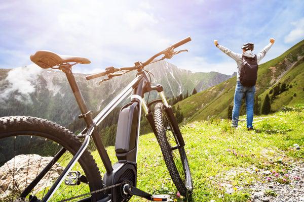 Man Riding E-Bike in Mountains