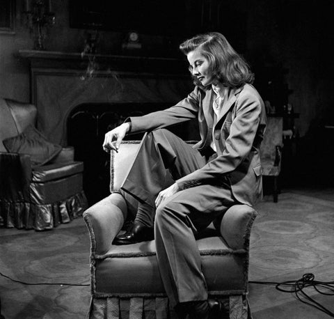 Katherine Hepburn wearing wide leg trousers. 