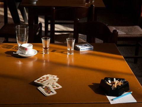 Table with card games and cigarettes